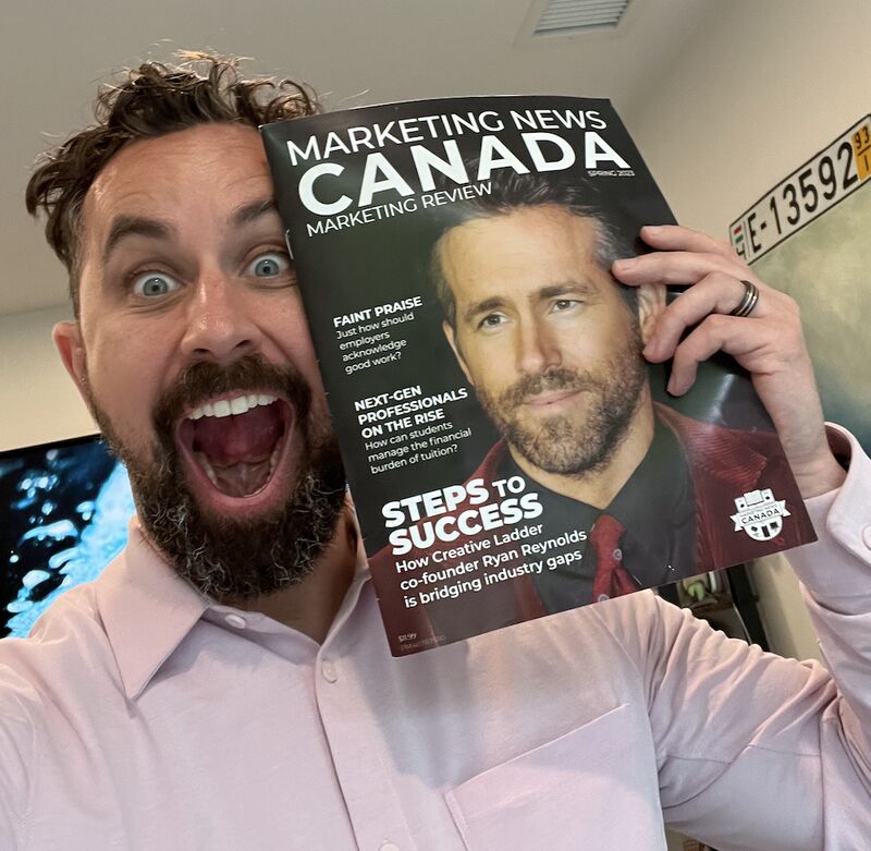 Happy Canadian professional reviewing financial success